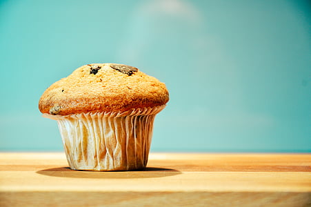 cupcake on brown wooden table thumbnail