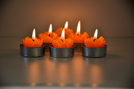 lighted orange tealight candles thumbnail