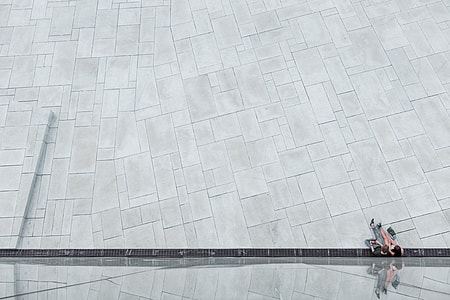 two people sitting on gray concrete surface thumbnail