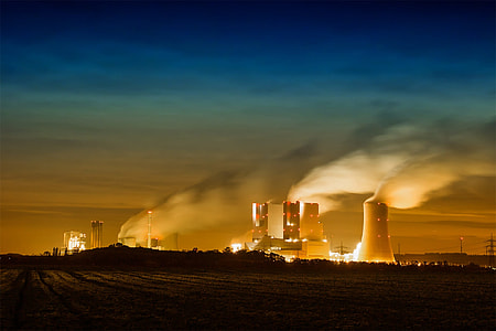 gray power plant under blue sky thumbnail
