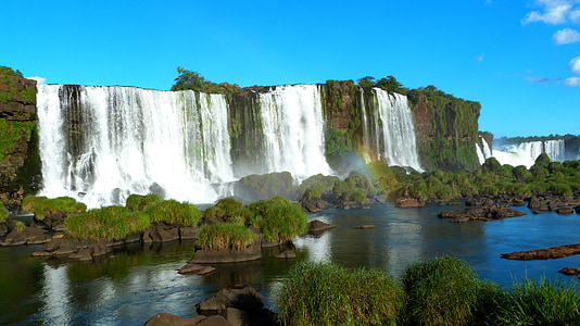 water falls with rocks during daytime thumbnail