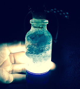 person holding glass lamp thumbnail