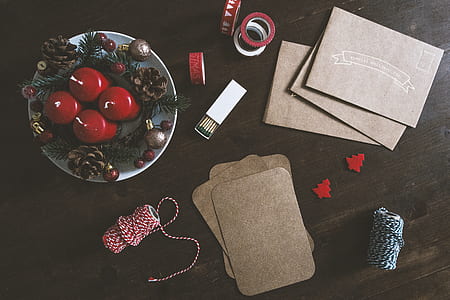 four red candles on gray ceramic plate thumbnail