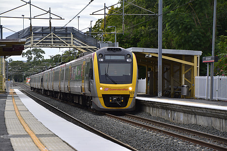 express train on train tracks during daytime thumbnail