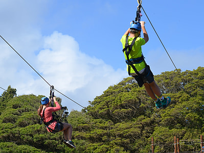 two person zip lining during daytime thumbnail