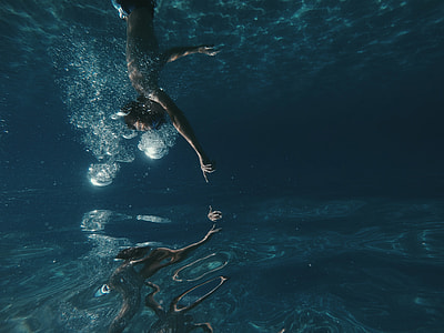 person diving in water thumbnail