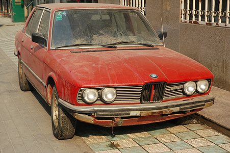 classic red BMW sedan thumbnail