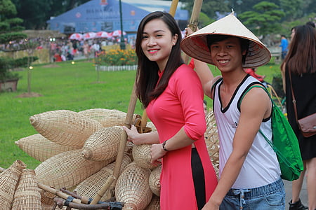 woman beside man with baskets thumbnail