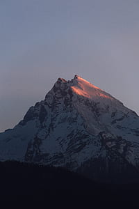 white and black snowed mountain at golden hour thumbnail