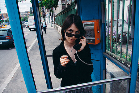 Girl in phone booth thumbnail
