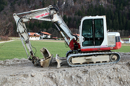 white and red cultivator near green grass field thumbnail