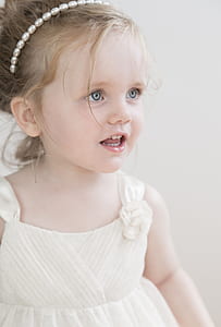 girl wearing white dress in closeup photo thumbnail