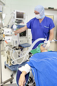 person using medical equipment on patient thumbnail