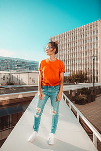 woman standing above building thumbnail
