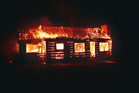 house burning during nighttime thumbnail