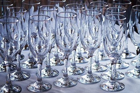 clear champagne flutes on white surface thumbnail