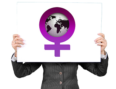person wearing gray blazer holding globe board thumbnail