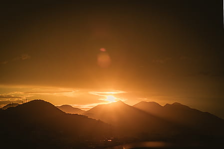 Silhouette Photo of Mountain Range during Golden Hour thumbnail