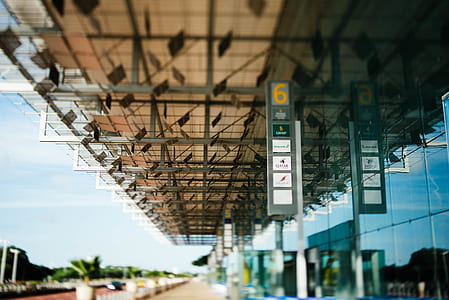 gray signages hanged on gray metal roof thumbnail