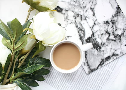 white peony flowers beside cup of coffee thumbnail