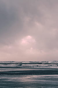 sea under cloudy sky during daytime thumbnail