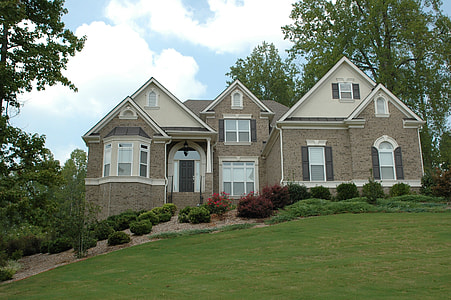 brown and beige house facade near forest thumbnail