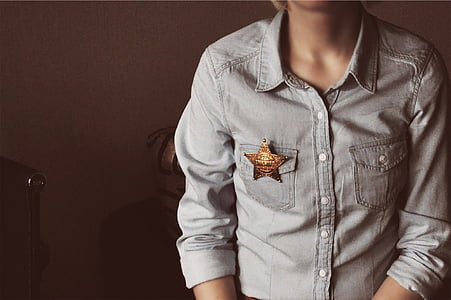 person wearing gray button-up shirt thumbnail