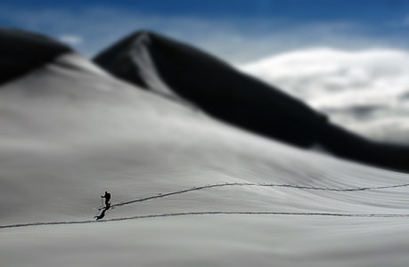 person walking on desert during daytime thumbnail