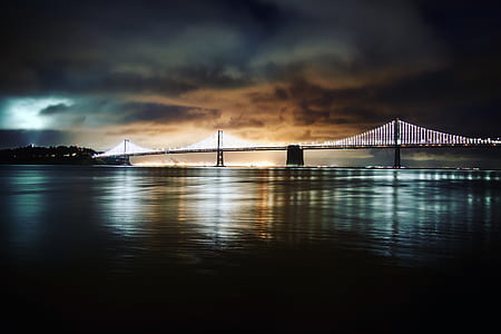 sea over bridge under white sky thumbnail