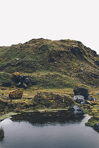 body of water near mountain thumbnail