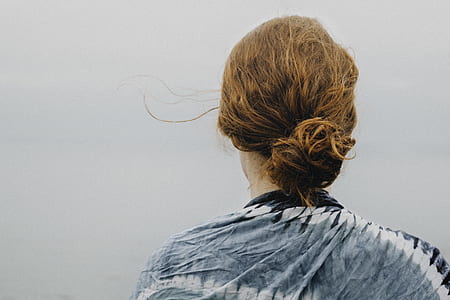 woman wearing blue and gray top thumbnail
