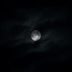 grayscale photo of moon during nighttime thumbnail