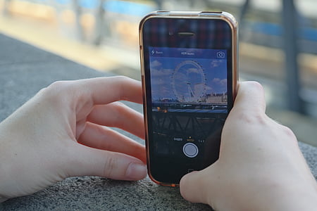 person taking picture of ferris wheel thumbnail