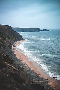 beach near mountain thumbnail