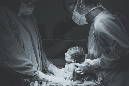 woman carrying new born baby thumbnail