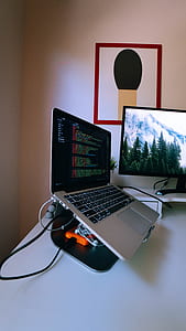 MacBook Pro on white wooden table thumbnail