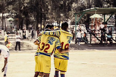 three football player hugging each other thumbnail
