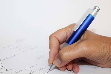 writing person holding rectractable pen thumbnail
