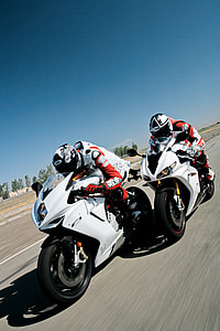 two racing players riding sports bikes thumbnail