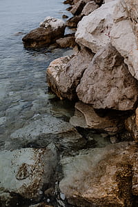 Rocks by waterside thumbnail