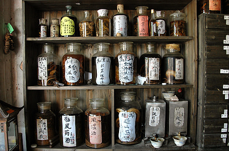 kanji-labeled jars on brown shelf thumbnail
