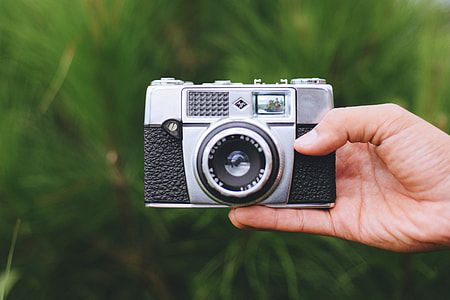 Agfa camera in photographer hand thumbnail