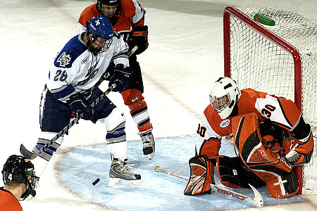 four person playing hockey thumbnail