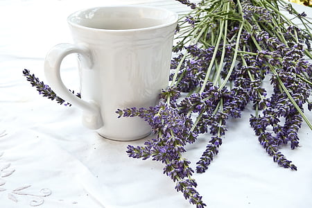white ceramic cup and purple cluster flower thumbnail