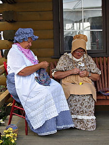 two women knitting clothes thumbnail