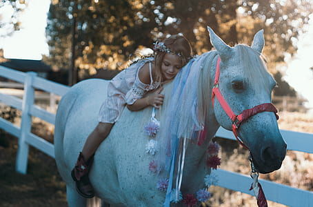 girl riding on horse back thumbnail