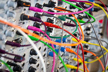 gray electronic devices with assorted-color cables thumbnail
