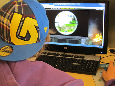 person playing FPS game on desktop computer thumbnail