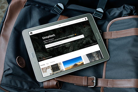 turned on gray Samsung tablet computer on black bag thumbnail