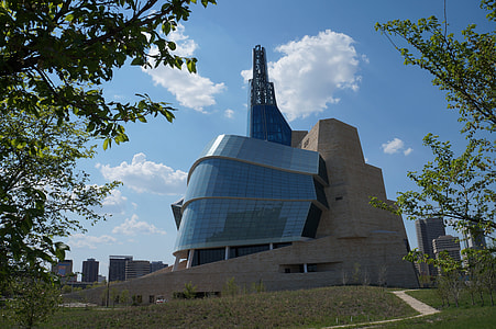 beige concrete building under blue sky at daytime thumbnail